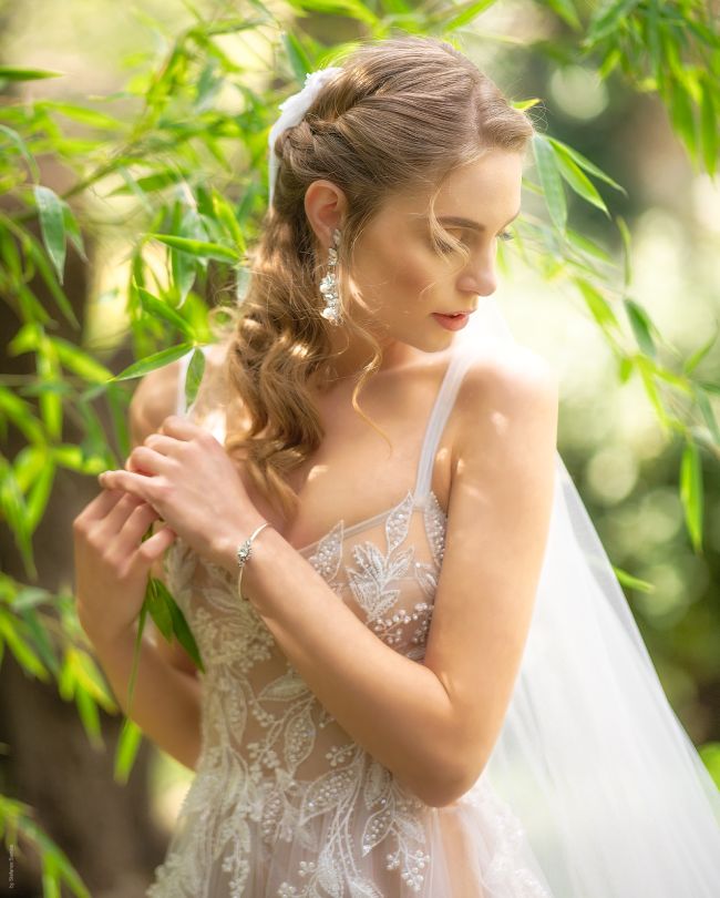 ethereal wedding dress woman looking to the side